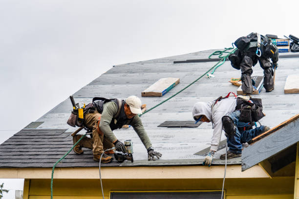 Professional Gutter Installation technician working in Plympton, MA